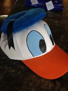 a baseball cap with an angry bird face on it