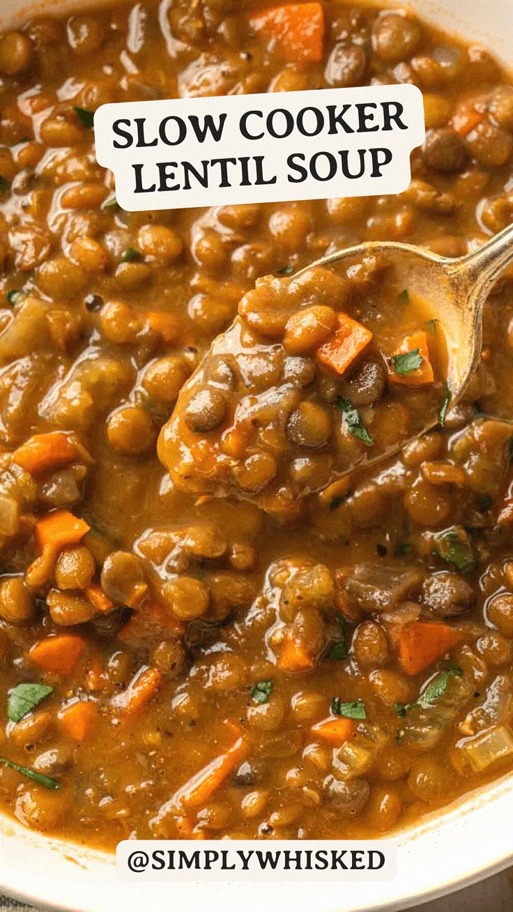 a white bowl filled with lentils and carrots, topped with a sign that reads slow cooker lentil soup