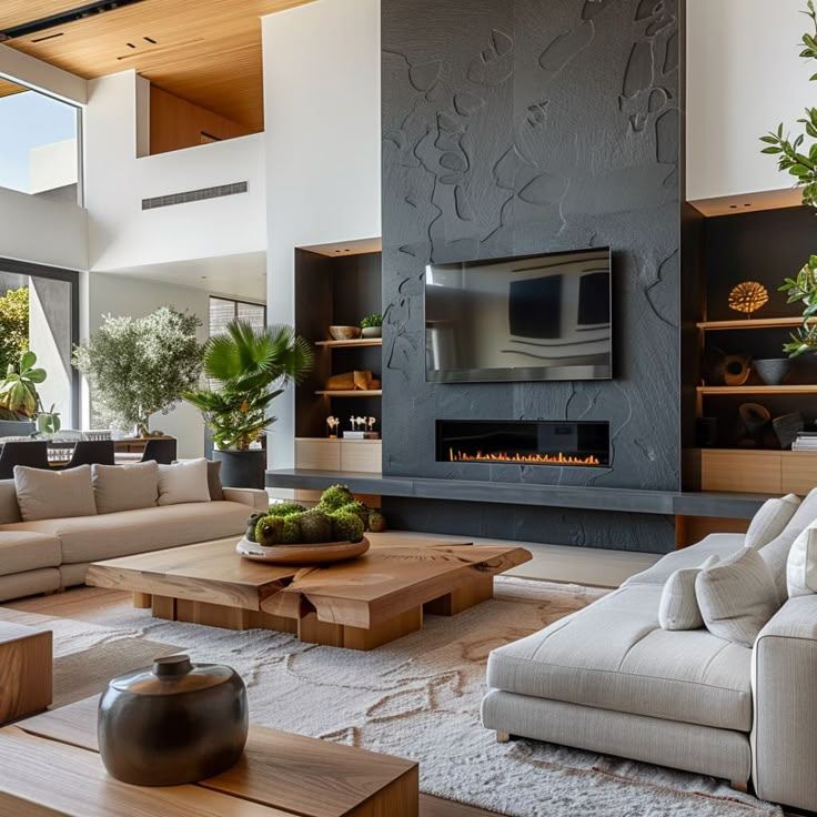 a living room with couches, tables and a fireplace