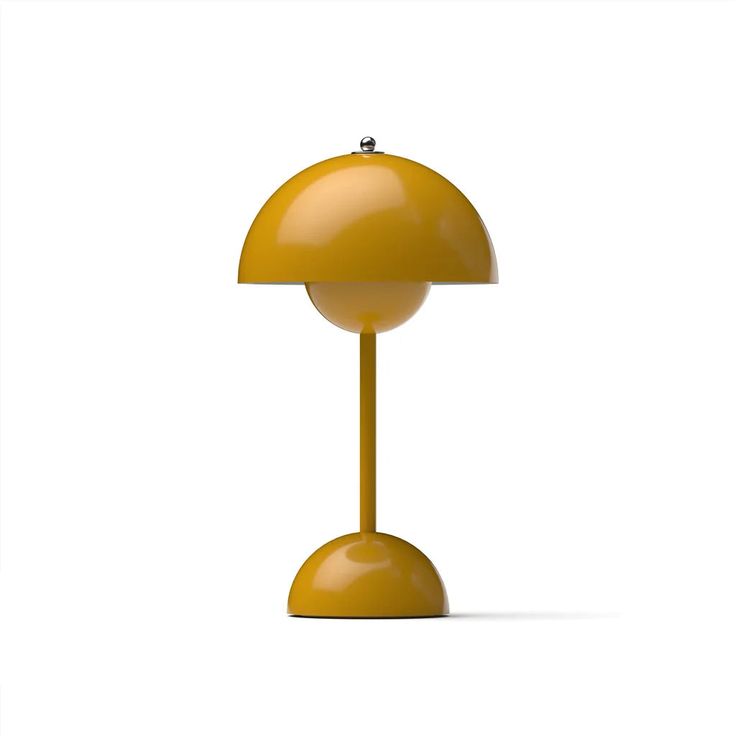 a yellow table lamp sitting on top of a white floor