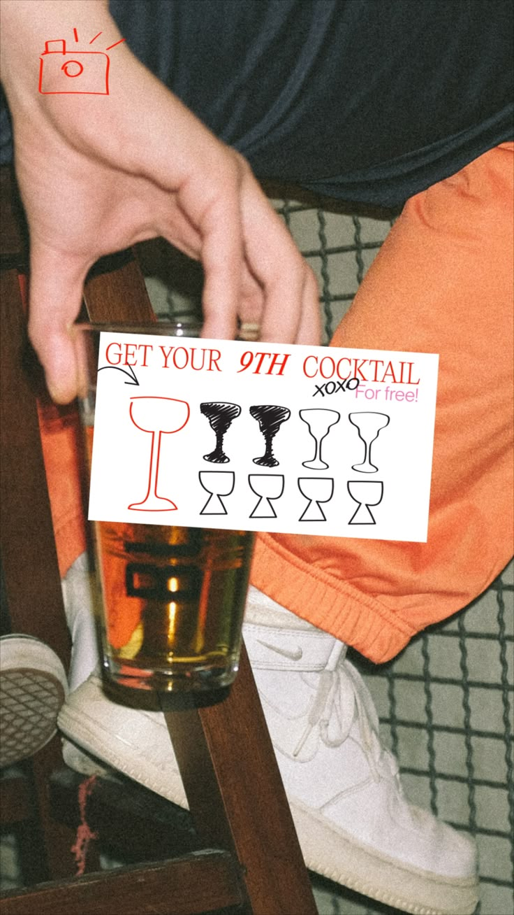 a person sitting on a chair holding up a sign with the words get your 9th cocktail