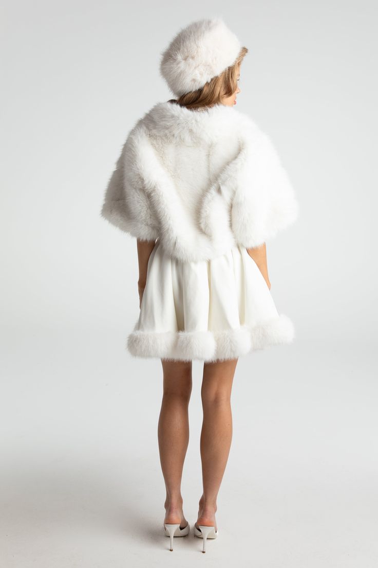 Cropped fur coats are our muse this season. Made of high-quality, environementally-friendly fur fabric, this chic coat is a perfect addition to your wardrobe. Its cropped design adds playfulness while the plush material adds warmth. Faux eco-friendly fur Cropped design Buckle included Dry clean only Chic White Sheepskin Outerwear, Chic White Fluffy Outerwear, White Sheepskin Outerwear With Faux Fur Trim, Luxury Faux Fur Winter White Outerwear, Elegant Winter White Faux Fur Coat, White Faux Fur Outerwear With Feather Trim, Chic Sheepskin Coat With Faux Fur Lining, Chic Sheepskin Fur Coat With Faux Fur Lining, Luxury White Fur Coat With Faux Fur Lining