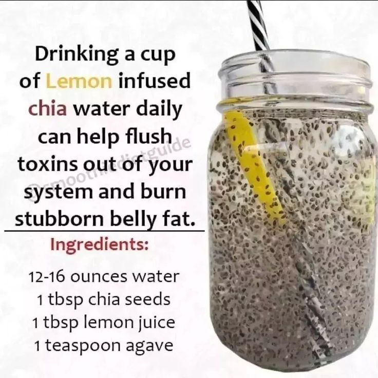 a jar filled with chia seeds next to a lemon slice and a straw in it