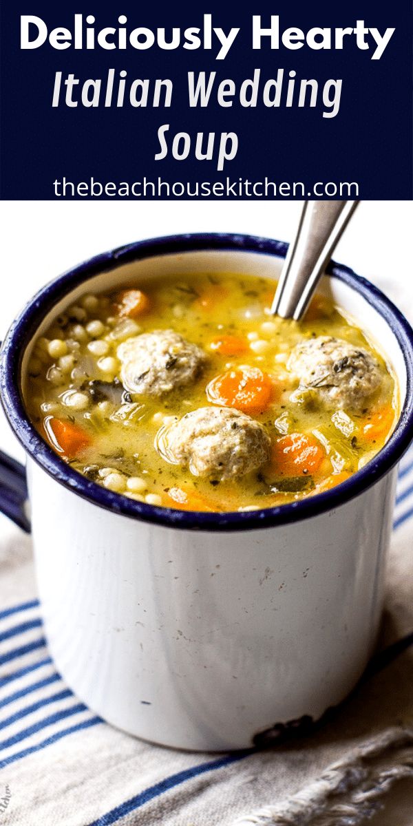 a bowl of italian wedding soup with meatballs and carrots in it is shown