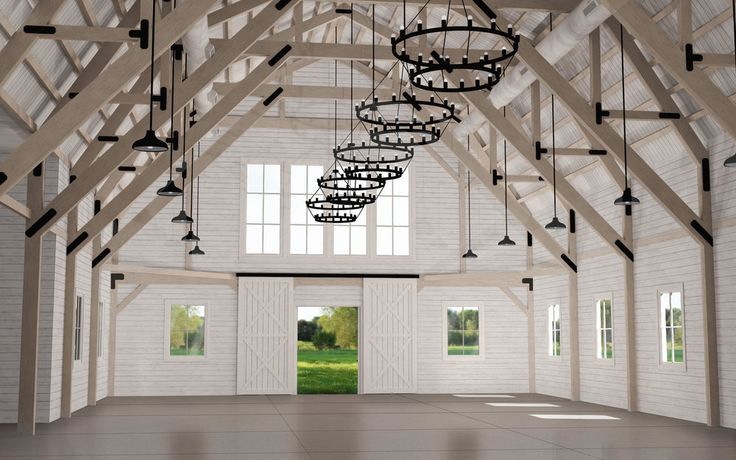 an empty room with chandelier hanging from it's ceiling and open windows