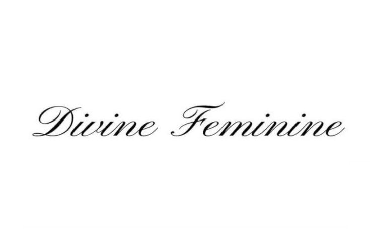 the word divine feminine written in black ink