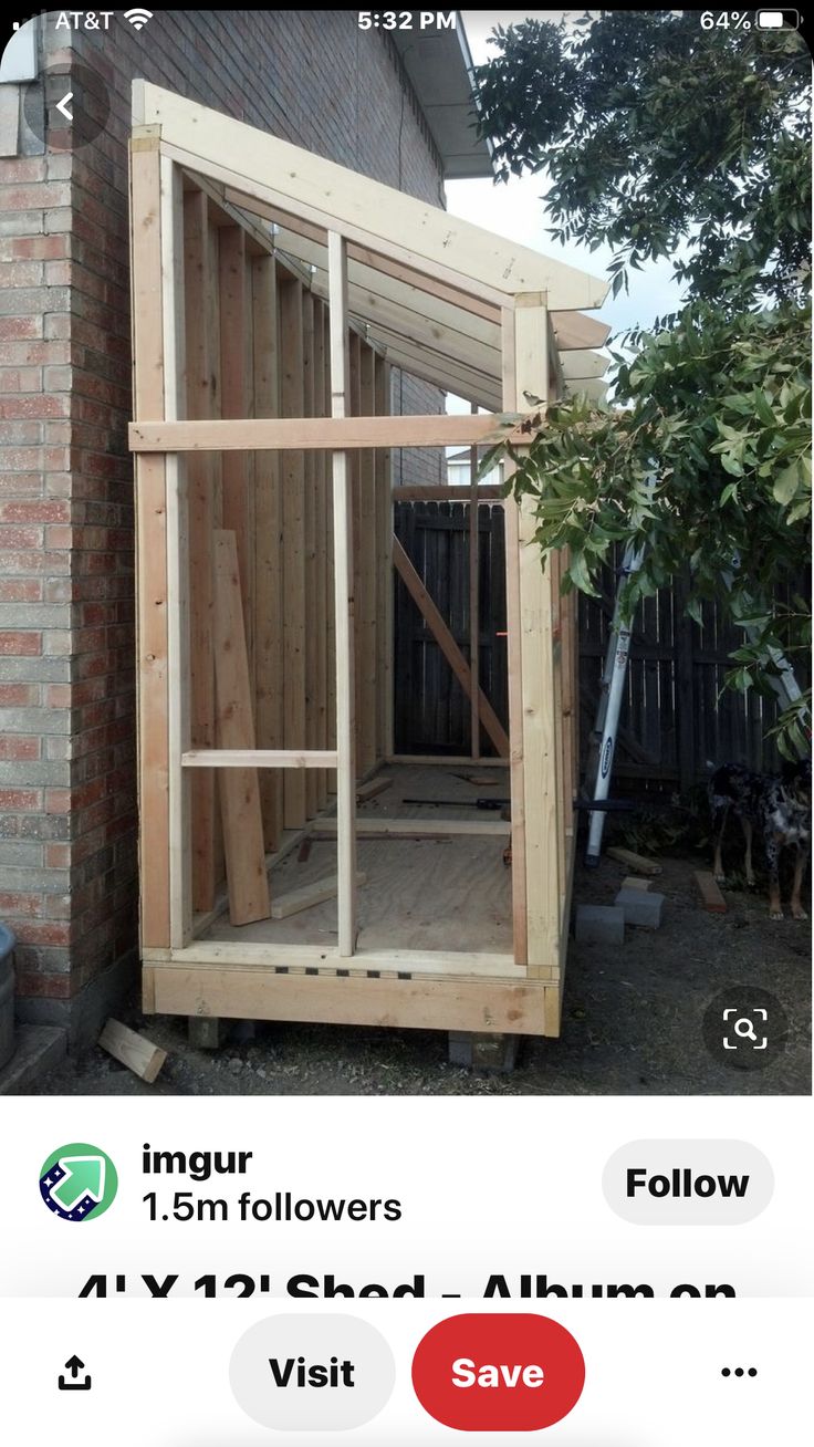 an image of a small house being built on the side of a building with windows and doors