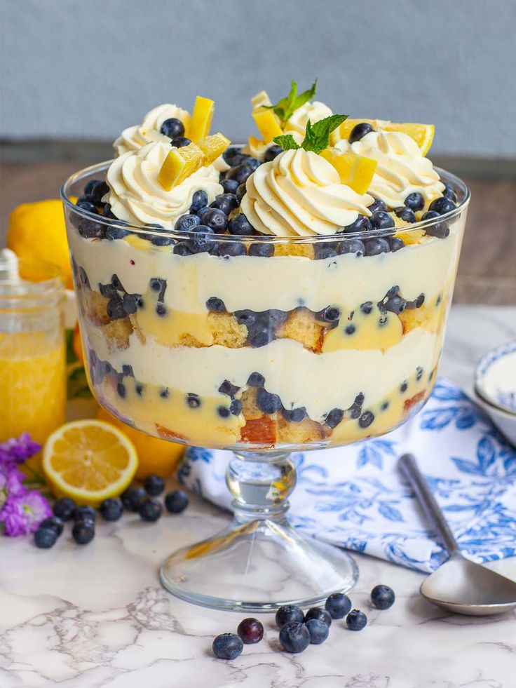 a trifle with blueberries, lemons and whipped cream