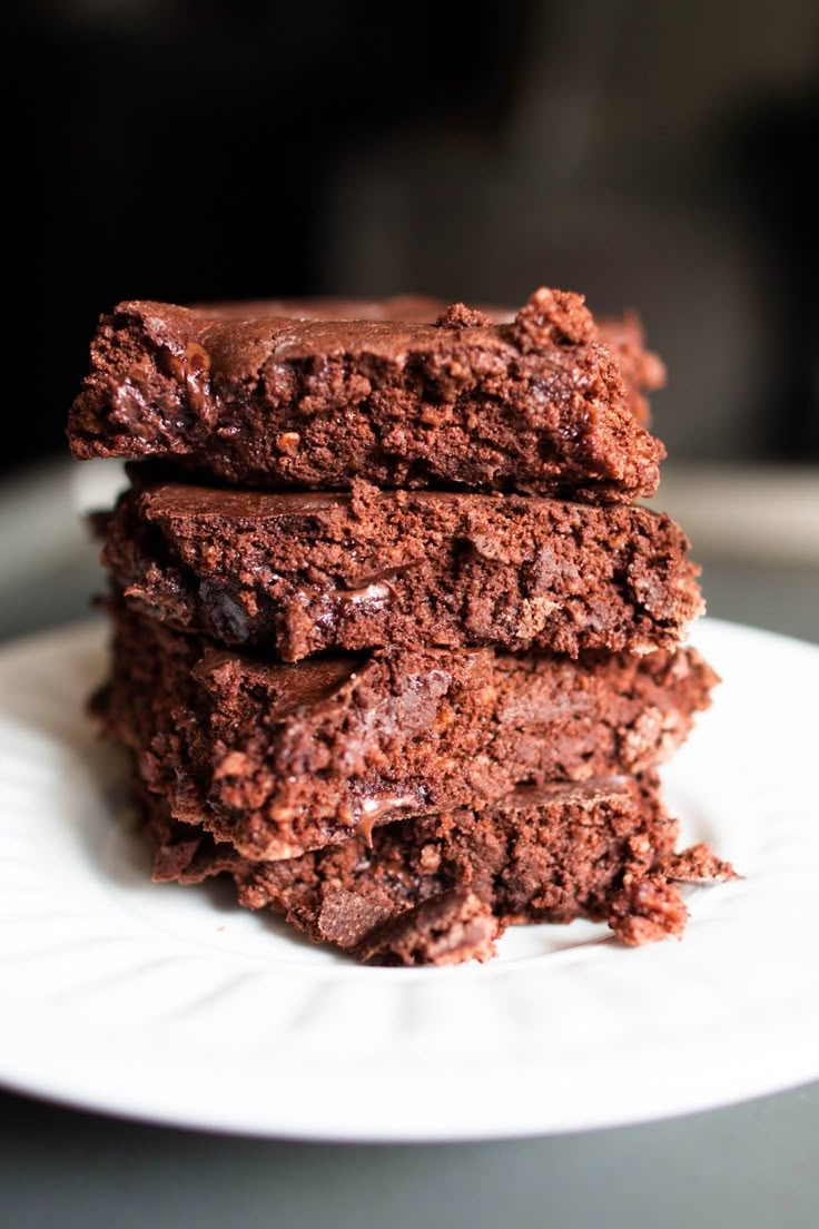 three chocolate brownies stacked on top of each other