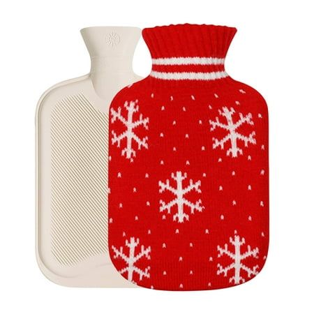 a red and white knitted hot water bottle cover with snowflakes on it