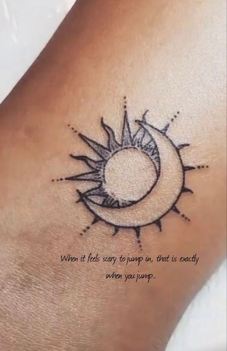 a woman's foot with a tattoo on it that says when it rains, the moon