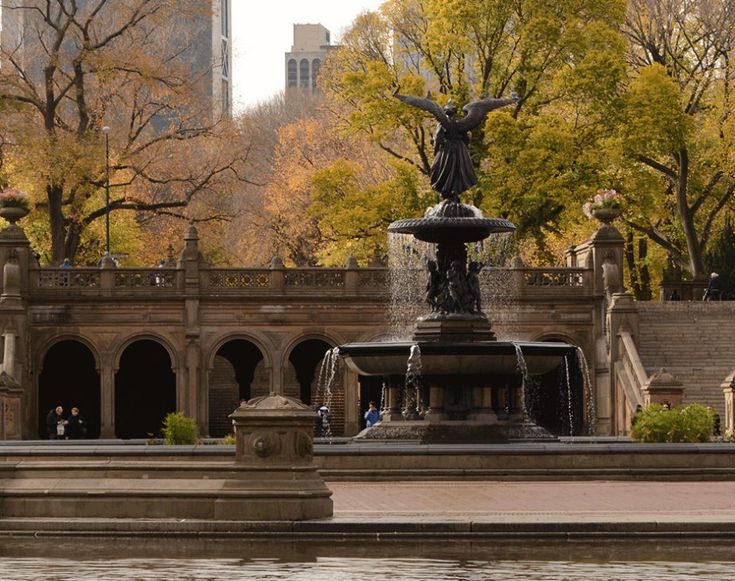 a fountain with an angel statue in the middle