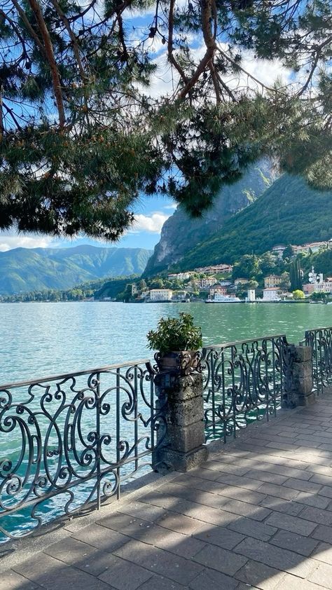 a bench sitting on the side of a lake