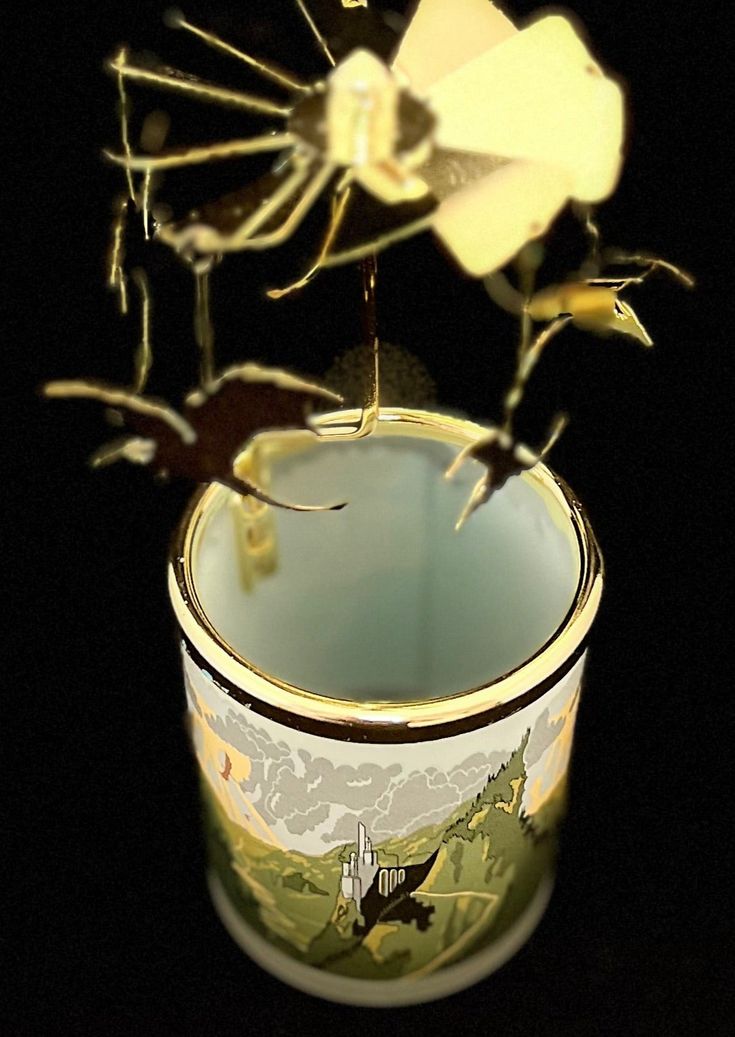 a vase with flowers in it sitting on a table