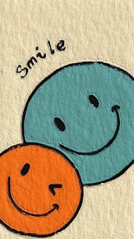 an image of two smiley faces with the words smile