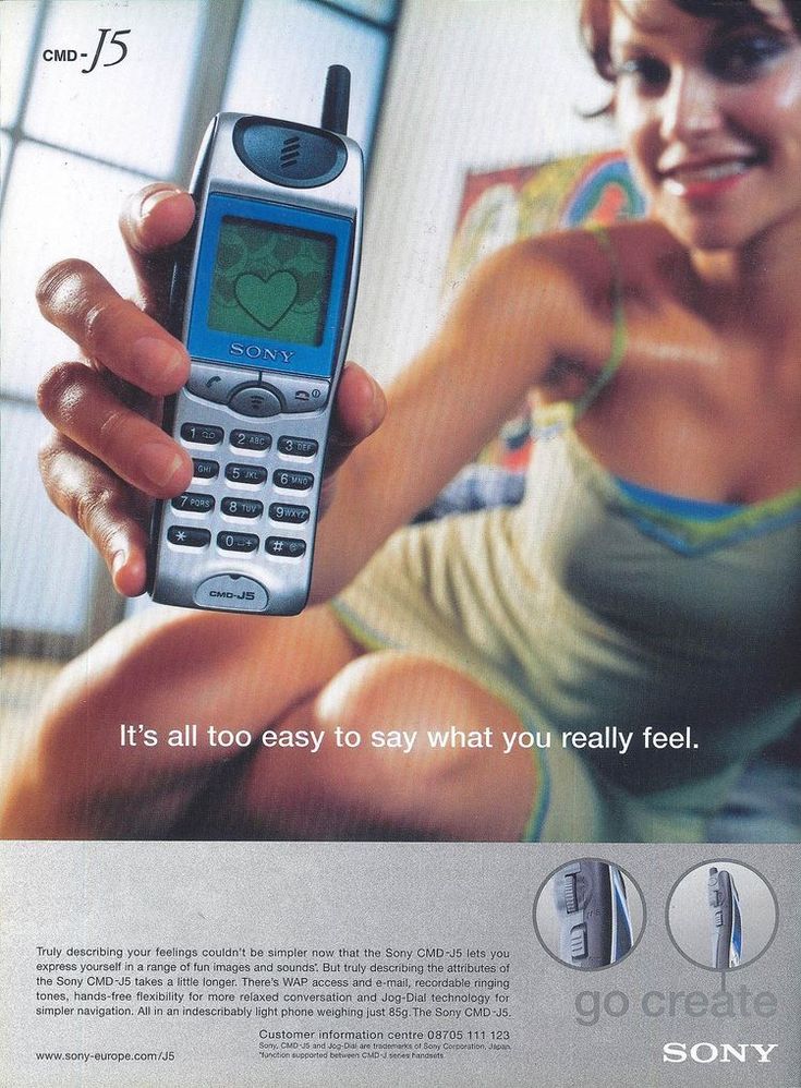 an advertisement for the sony cell phone with a woman holding it in one hand and smiling at the camera