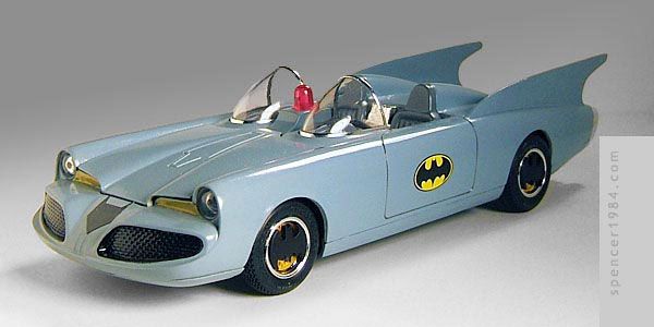 a toy batman car is shown on a white background