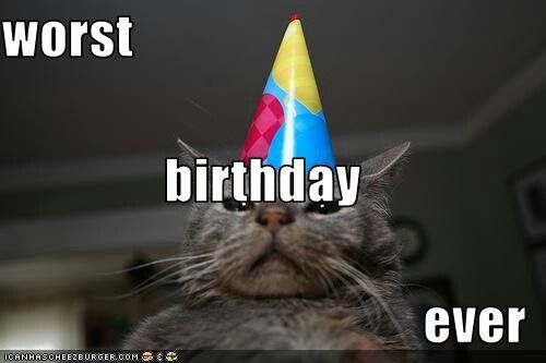 a cat wearing a birthday hat with the caption worst birthday ever