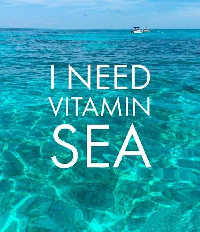 the words i need vitamin sea are in front of an image of a boat on the ocean