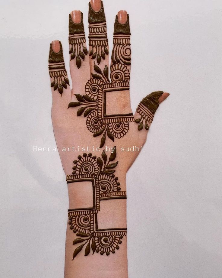 hendi design on the palm of a woman's hand