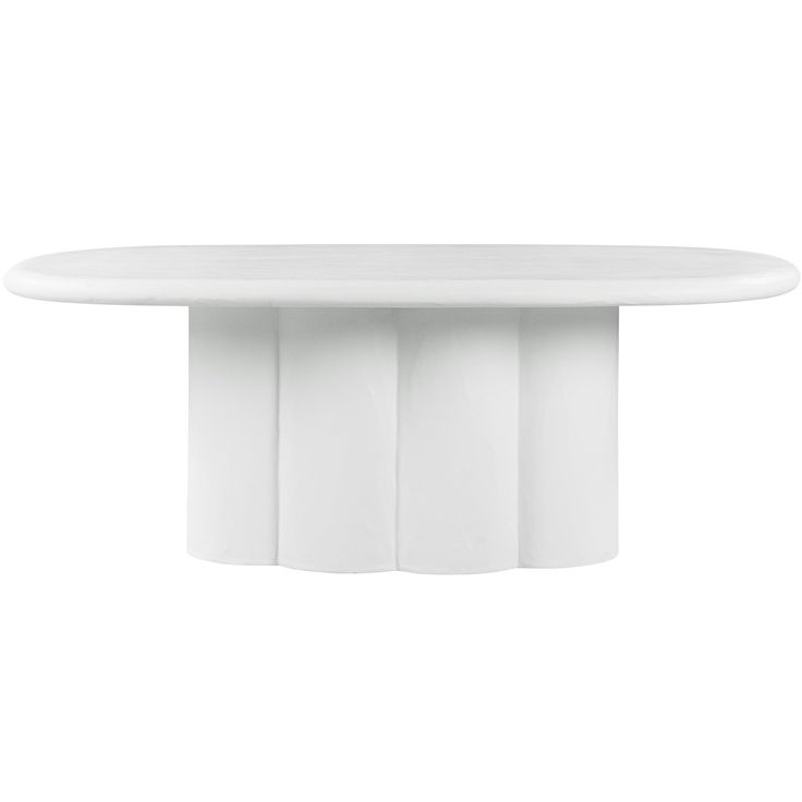 an oval white table with four columns on the top and one column at the base