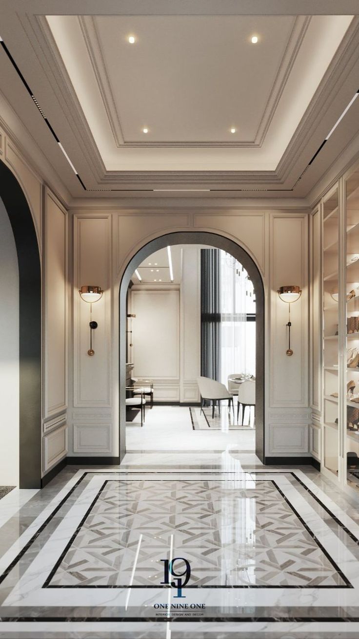 an elegant hallway with marble floors and white walls