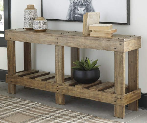 a wooden table sitting in front of a couch