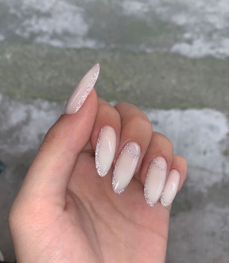 Milky White Nails Silver Glitter, Milky White Nails With Glitter Almond, Milky White Nails Acrylic Design Almond, Elegant Almond Nails Classy White, Milky White Silver Nails, Milky White And Glitter Nails, Milky White Sparkly Nails, Milky White Nails Glitter, Almond Nails Milky White