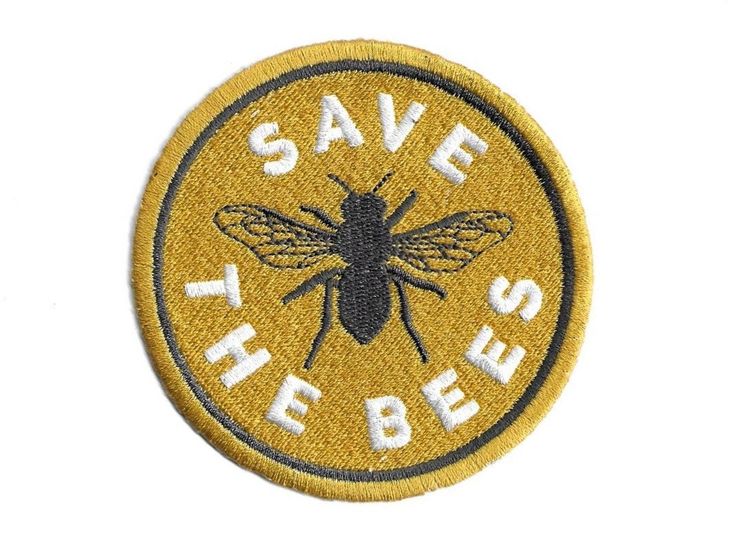 the save the bees logo on a yellow and black patch