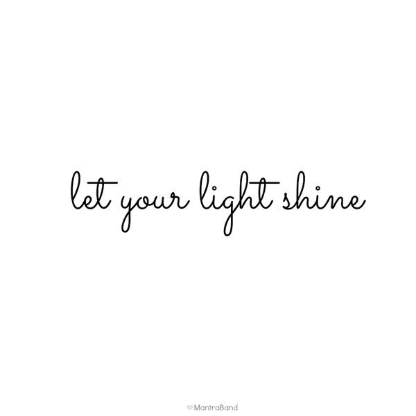 the words let your light shine written in black ink