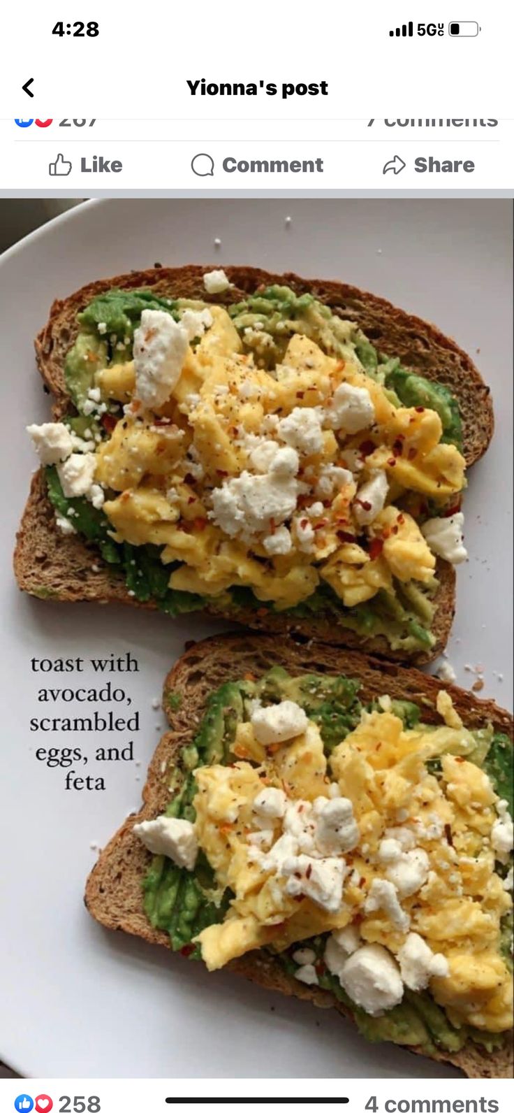 two pieces of bread with eggs and cheese on them sitting on top of a white plate