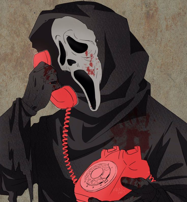 a person in a hooded jacket talking on a red phone with a scary mask on their face