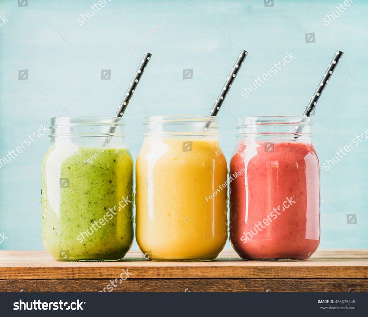 three jars with different colored smoothies in them