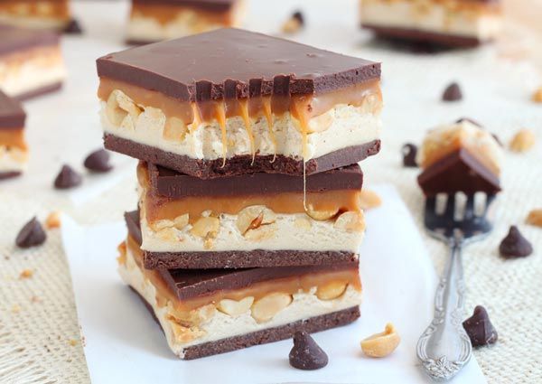 four pieces of chocolate and peanut butter ice cream bars stacked on top of each other