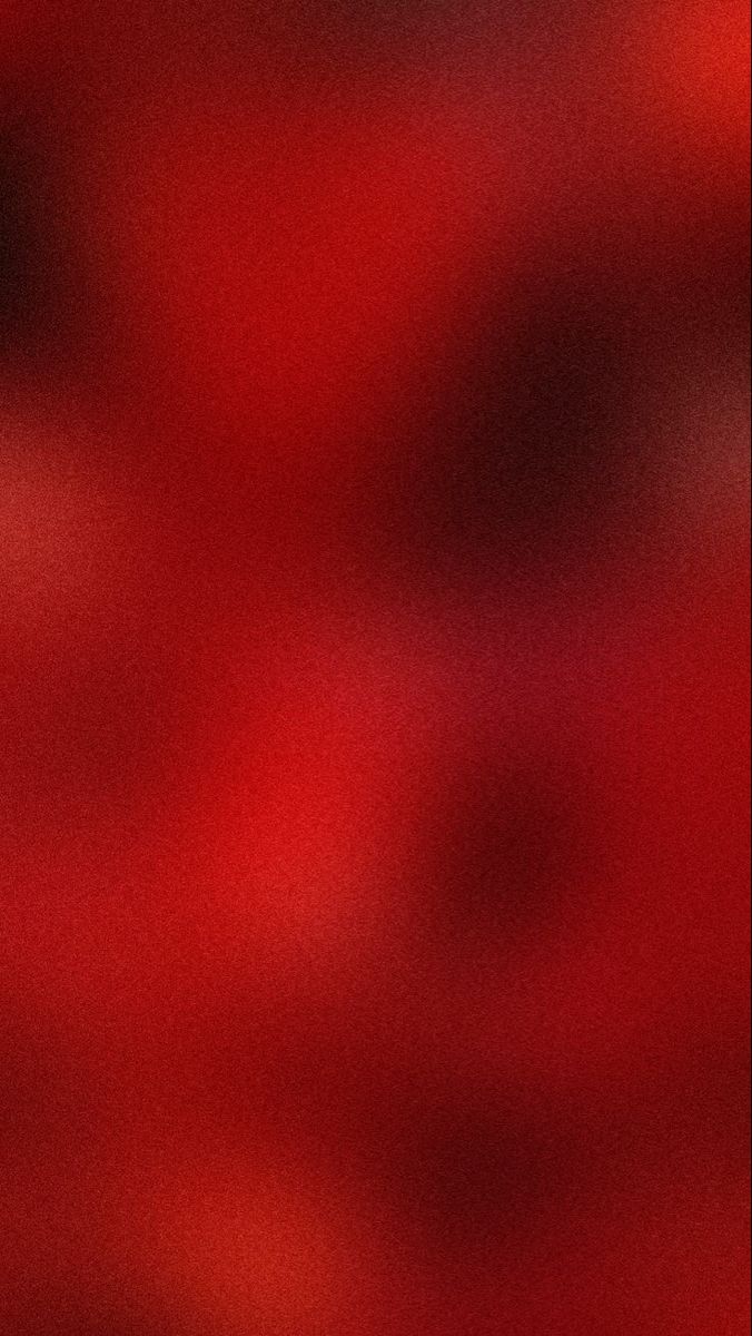 a blurry image of red and black colors