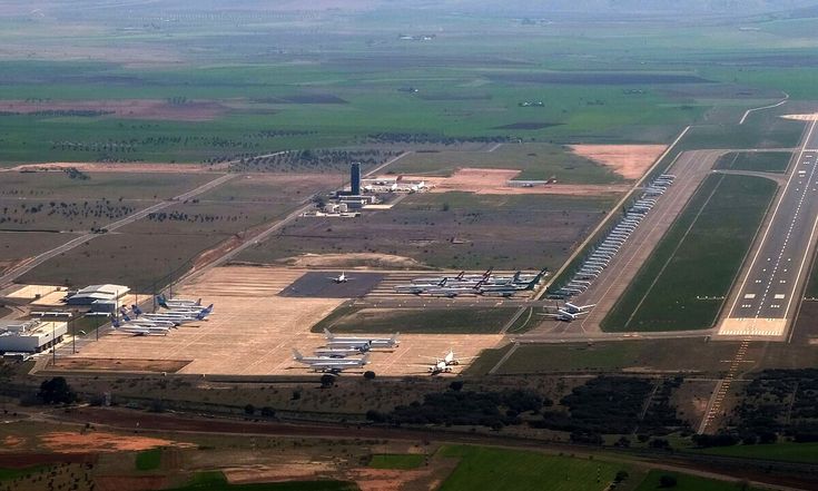 an aerial view of the airport and runway