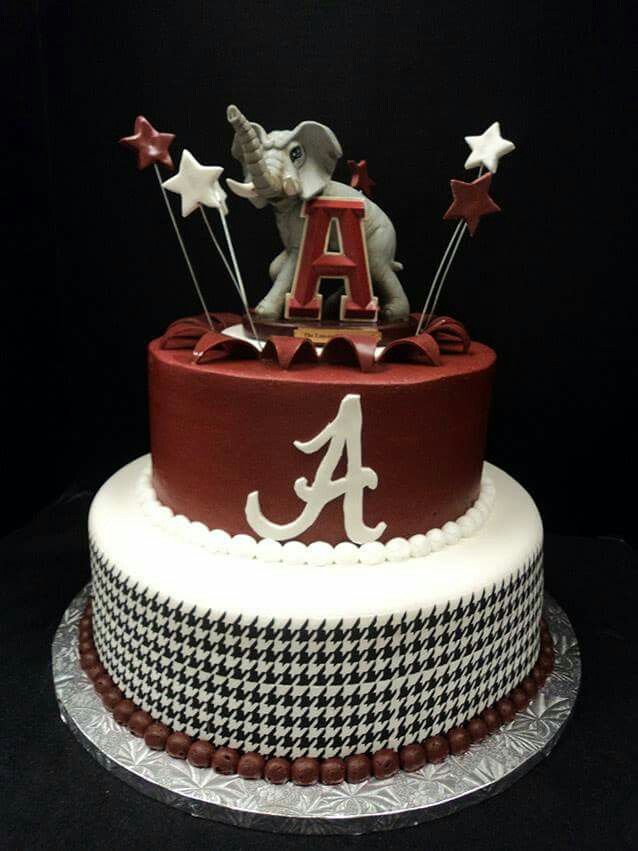 a red and white cake with an elephant on top