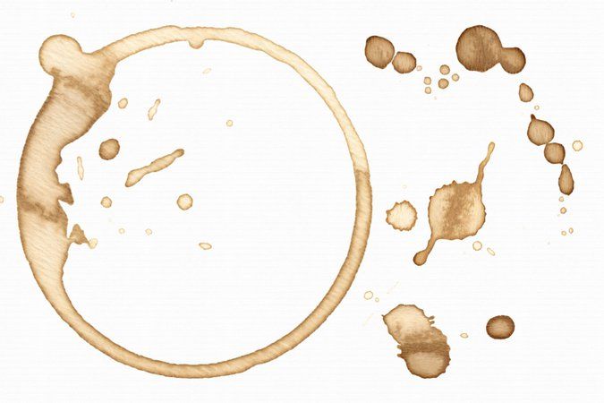 a coffee stain splattered on top of a white surface