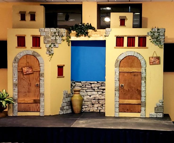 a stage set up for a play with doors and windows