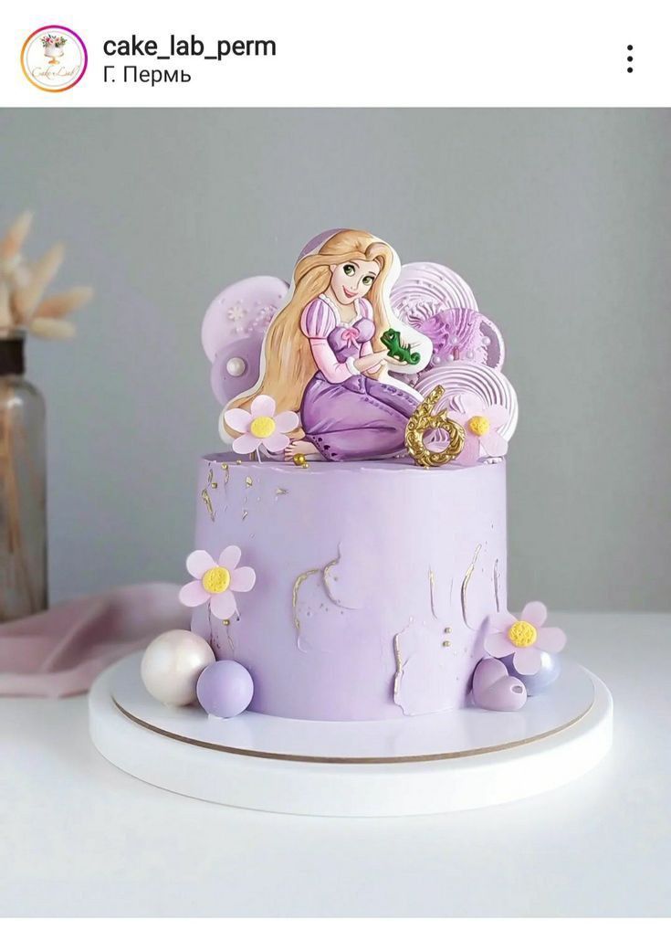 there is a purple cake with a princess on it