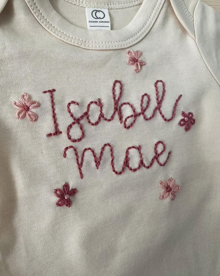 Absolutely ADORE the flower request on this newborn onesie! PLEASE always request special customizations- I’d love to make something personal for you! #newbornbodysuit #newbornonesie #custominesie #customembroidery #handembroidery Embroidered Onesie Girl, Baby Onesie Embroidery, Hand Embroidered Onesie, Embroidered Baby Clothes, Embroidered Onesie, Newborn Bodysuit, Newborn Onesies, D Love, Embroidery Gifts