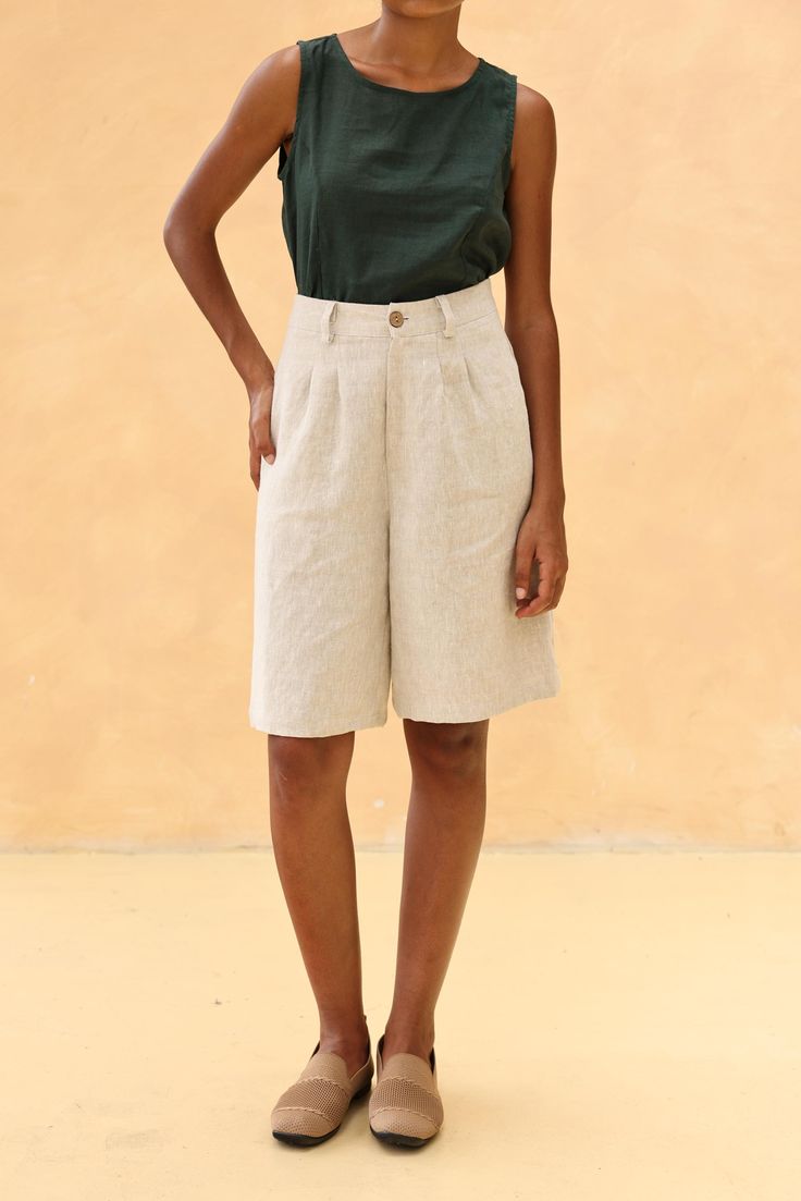 The linen loose-fitted knee-length shorts offer a comfortable and casual fit, perfect for warm days. Handcrafted in our studio to your measurements and preferences, available in over 60 colors. DETAILS - 100 % linen, medium weight (200gsm), free-shrinkage, amazingly soft feel - Knee-length shorts; different length is possible - Loose fit - High waisted - Pleated front - Front button and zipper - Inseam pockets - Custom made pants, FREE customizations; simply let us know your needs (hem length, fit style, leg opening width, belt, etc.). - Handcrafted in our studio, French seams, clean and meticulous COLOR - The color shown is Beige. - Available in over 60 colors, choose color in the color chart in the listing. - Link of fabric samples available here: https://madebygaiavn.etsy.com/listing/13 Linen Bermuda Shorts With Built-in Shorts And Relaxed Fit, Summer Wide Leg Shorts With Built-in Shorts, Knee-length Bottoms With Built-in Shorts For Vacation, Linen Bermuda Shorts For Spring, Casual Linen Bermuda Shorts, Spring Linen Bermuda Shorts, Spring Knee-length Bermuda Shorts With Pockets, Knee-length Summer Shorts For Vacation, Knee-length Vacation Shorts For Summer