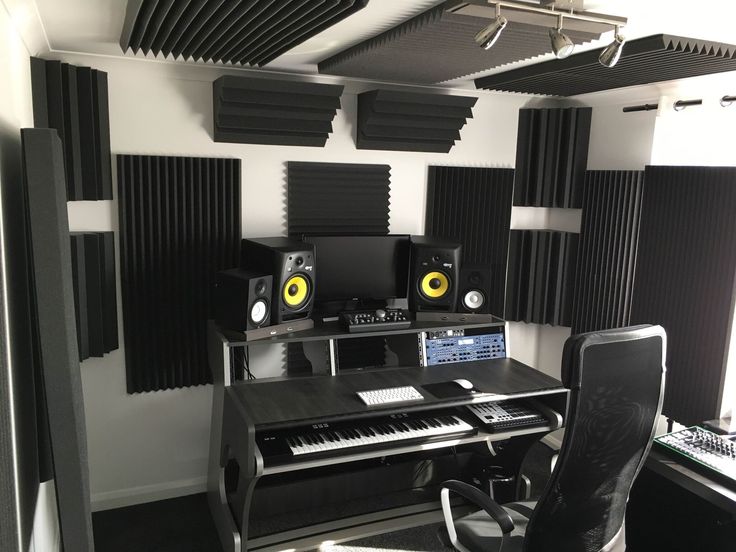 a recording studio with sound equipment and speakers