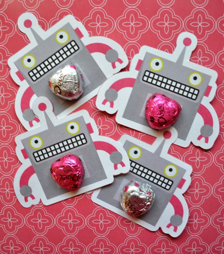 three valentine's day chocolates in the shape of robots