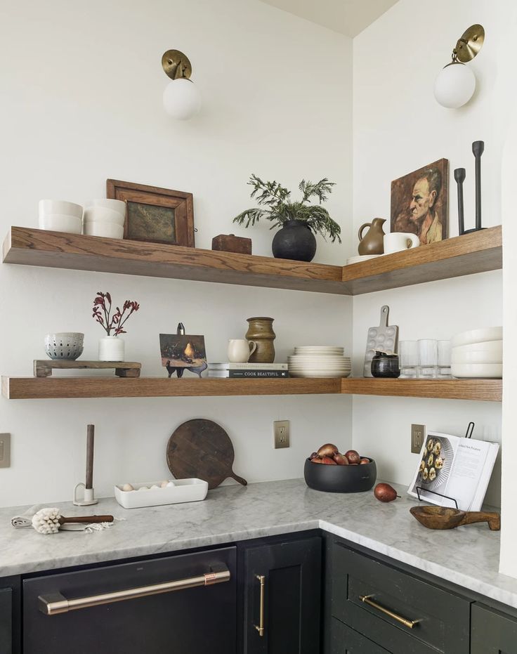 the kitchen is clean and ready for us to use it's open shelving