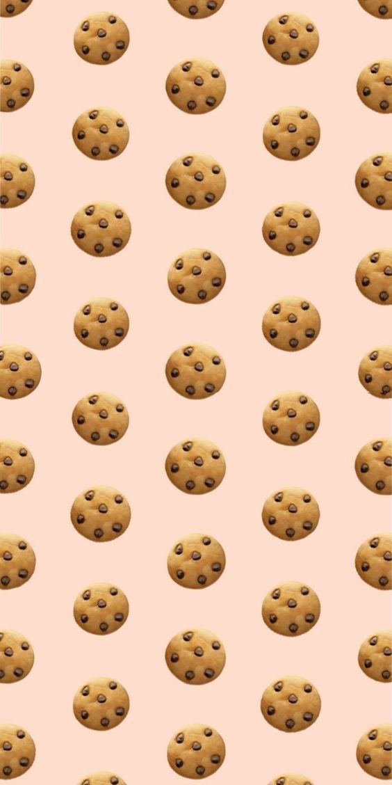 a pink background with chocolate chip cookies on it