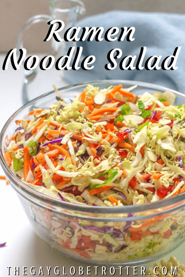 a glass bowl filled with coleslaw and carrots