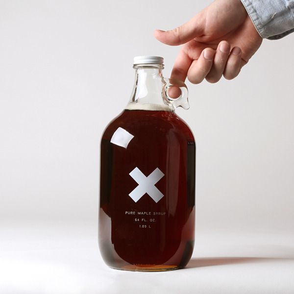 a hand reaching for a bottle with an x on it