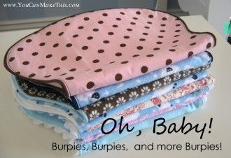 a stack of baby blankets sitting on top of a table