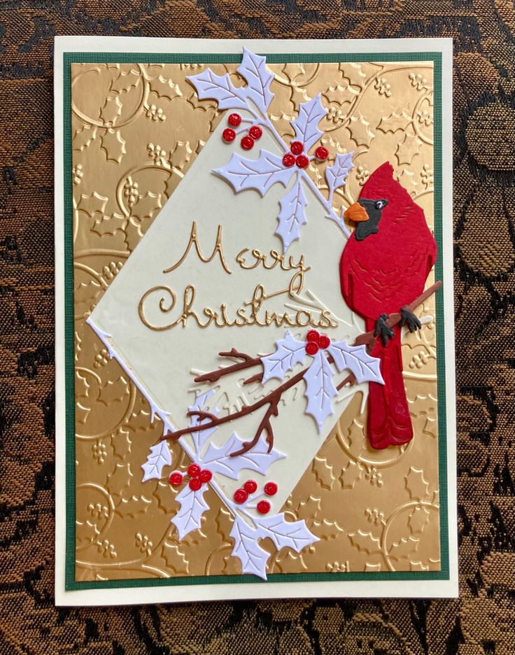 a christmas card with a cardinal on it